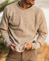 Man Wearing and Gripping The Cusco Timber / Light Grey Alpaca Wool Crewneck Sweater – PAKA Apparel