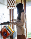 Model Wearing Women's Natural Tri-Blend Terry Shorts While Putting on Vinyl Record in a Cabin – PAKA Apparel