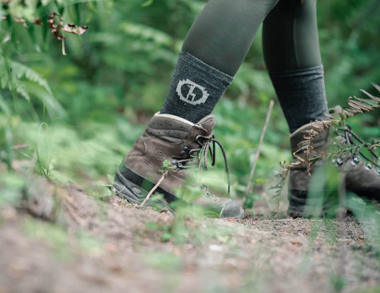 Dark Grey Alpaca Wool Crew Socks on Hiker Wearing Boots - PAKA Apparel