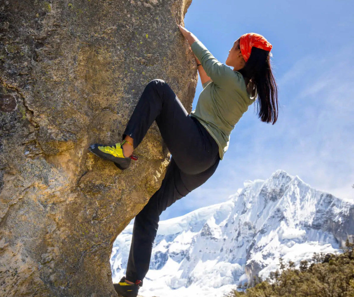 Woman Rock Climbing in Natural Fiber Alpaca Wool Baselayer - PAKA Apparel