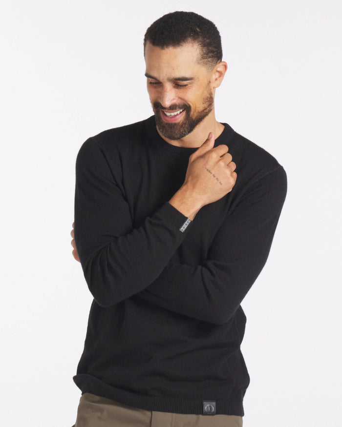 Man Smiling with Arms Crossed in Black Ultralight Crewneck Alpaca Sweater - PAKA Apparel