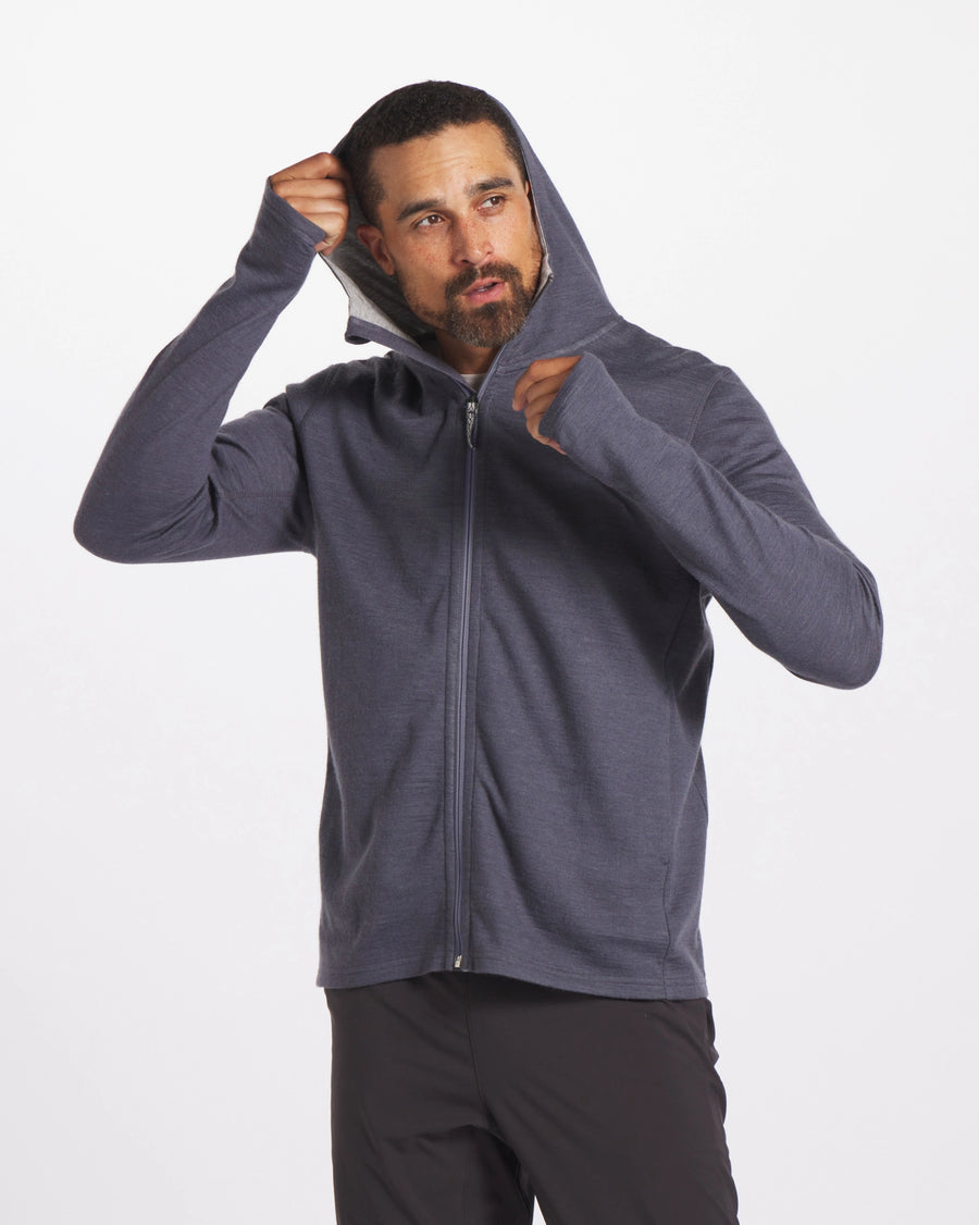 Man Putting Up Hood of Charcoal Blue Breathe Full-Zip Alpaca Blend Lightweight Hoodie – PAKA Apparel