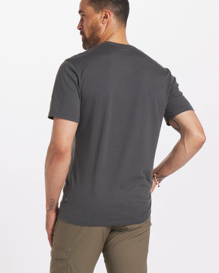 A man from behind wearing a charcoal alpaca wool men's t-shirt