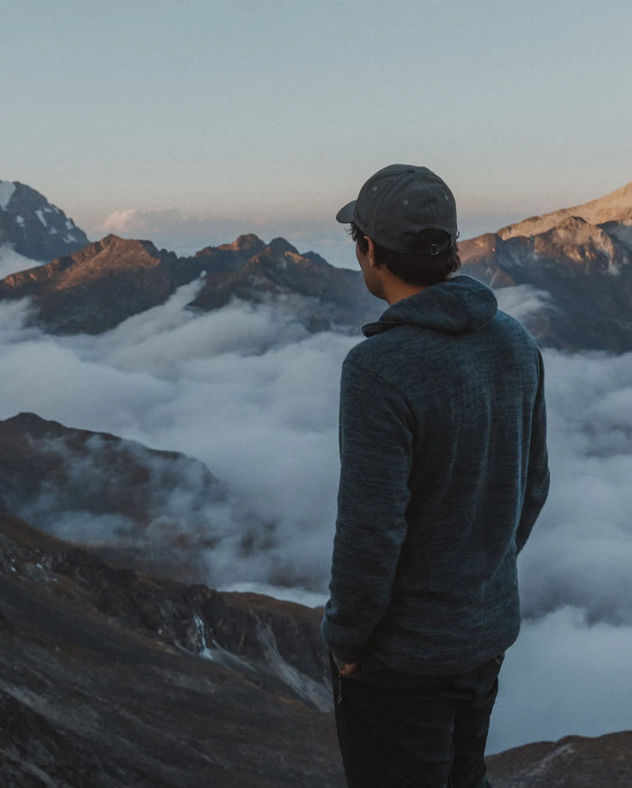 Man Looking at Peruvian Mountain Peaks Above Clouds in Dark Grey Alpaca Wool Sweater Hoodie – PAKA Apparel