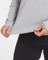 Close Up of Man Gripping Waist of Silver / Light Grey Alpaca Wool Thermal Baselayer Longsleeve Shirt – PAKA Apparel