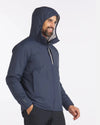 Man Smiling with Hood Up of Navy Blue Apu Lightweight Puffer Jacket – PAKA Apparel
