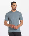 Man looking into distance wearing the Men's Tee in Steel