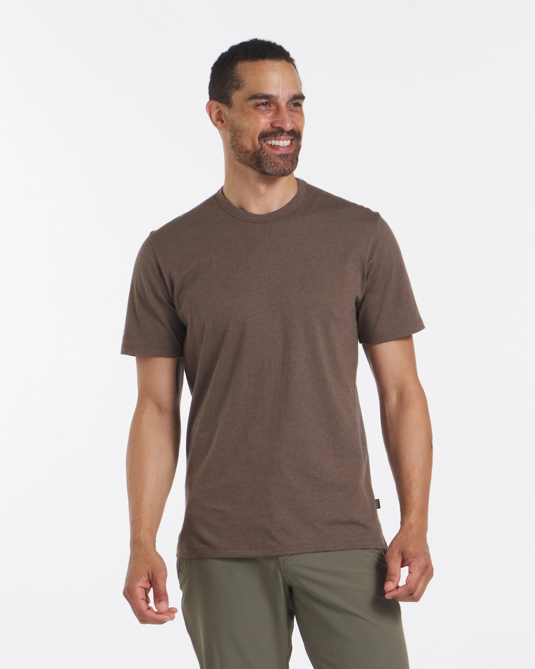 A smiling man wearing a brown Men's Alpaca Wool Tee Shirt  