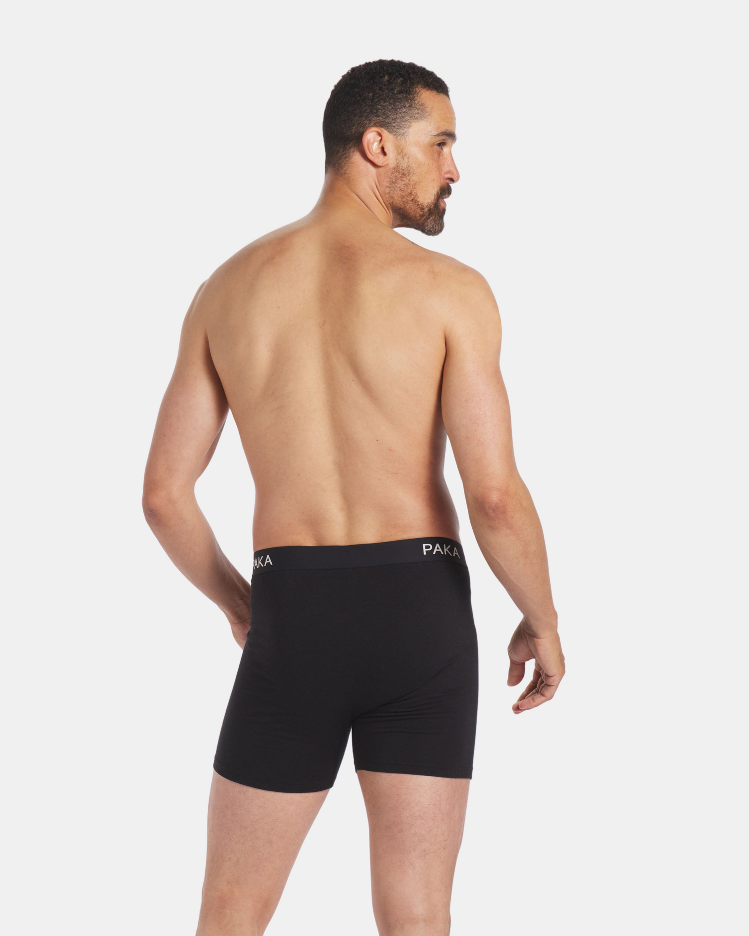 Backside of Man Wearing Black Alpaca Natural Underwear Boxer Briefs – PAKA Apparel