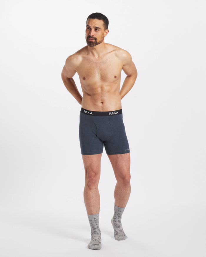 Man with Hands Behind Back Wearing Blue Ethical Alpaca Underwear Boxer Briefs – PAKA Apparel