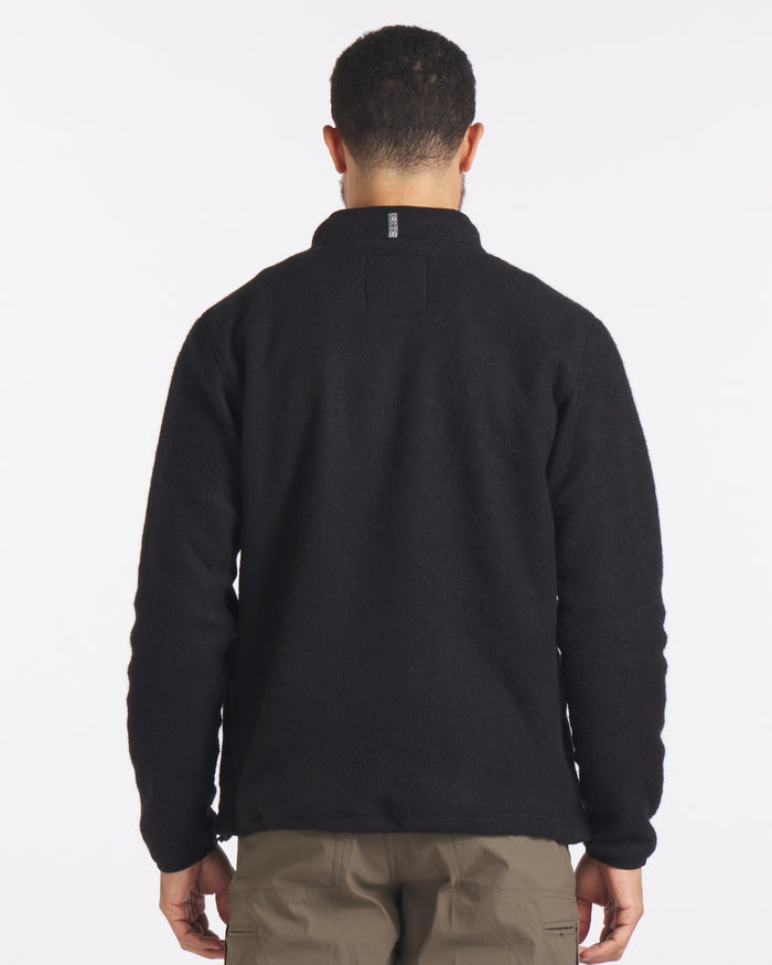 Back shot of Man wearing black fleece