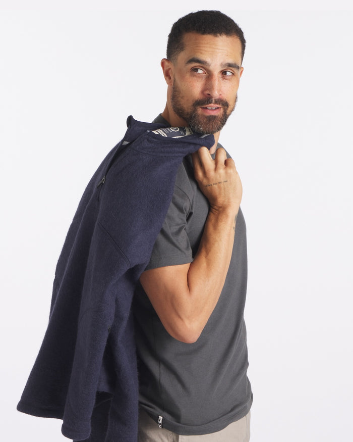 Man holding fleece over shoulder