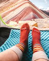 Rainbow Mountain Alpaca Socks from Peru Worn on Feet in Tent with View of Actual Rainbow Mountain – PAKA Apparel