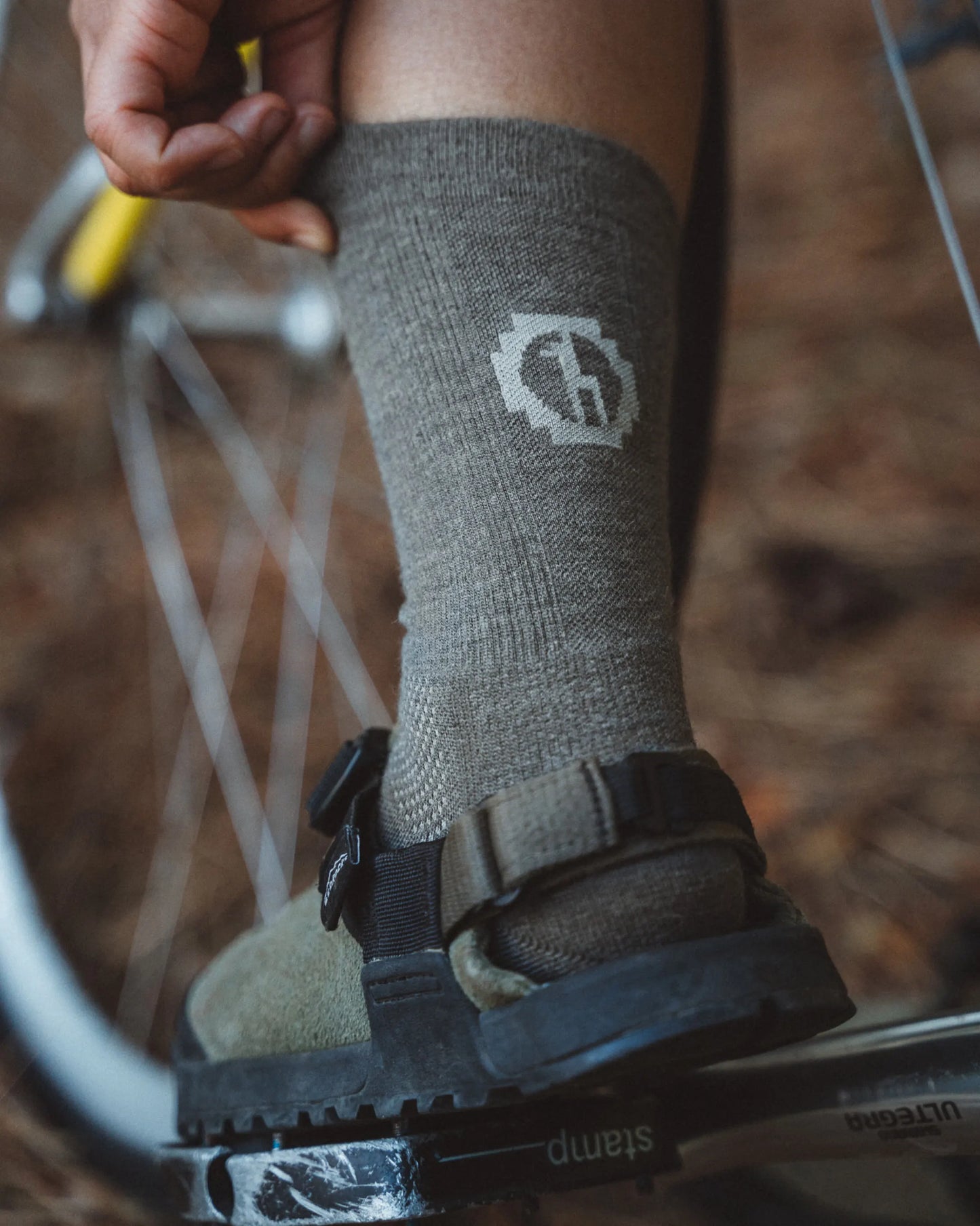 Forage / Dark Grey Natural Fiber Alpaca Wool Crew Socks on Leg of a Biker – PAKA Apparel