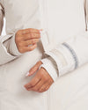 Close-Up of Hands Through Thumbholes of Women’s Noni / White Apu Parka Jacket – PAKA Apparel