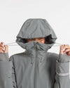 Woman Pulling Drawcord of Hood on Forage Grey Apu Parka Waterproof Winter Jacket – PAKA Apparel