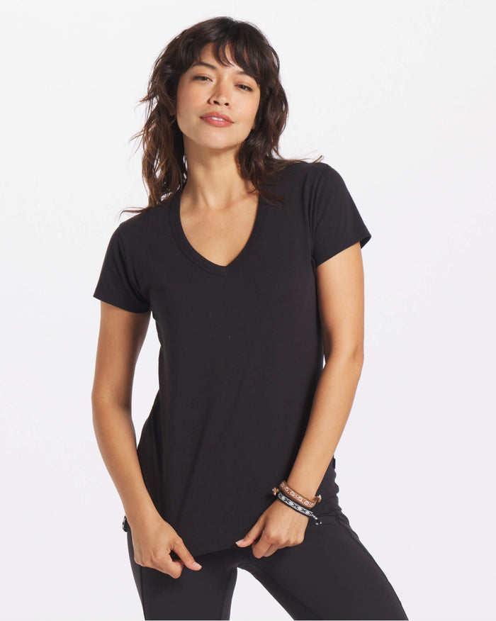 Woman's v neck tee in black on model 