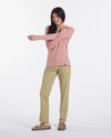 Woman Smiling While Stretching Shoulder in Guava / Pink SPF UPF Lightweight “Sol” Sun Hoodie – PAKA Apparel