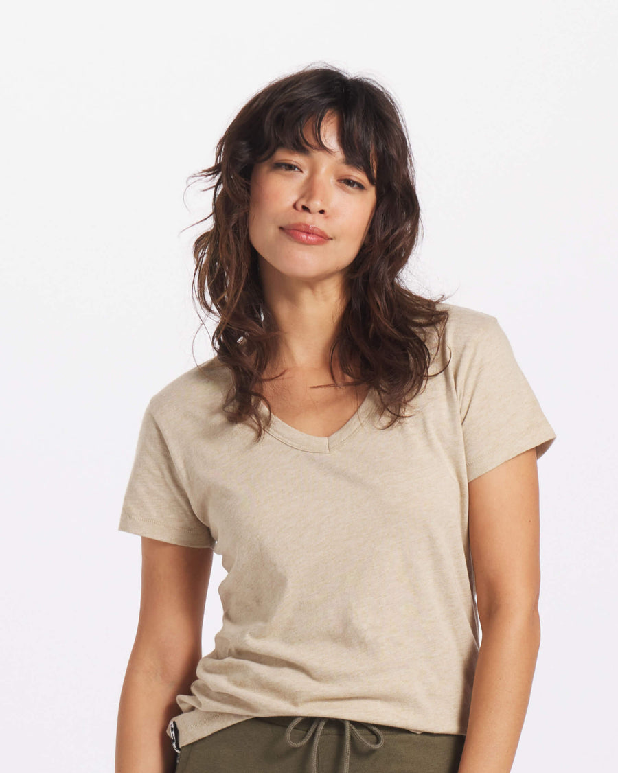 Woman's v neck tee in tan on model 