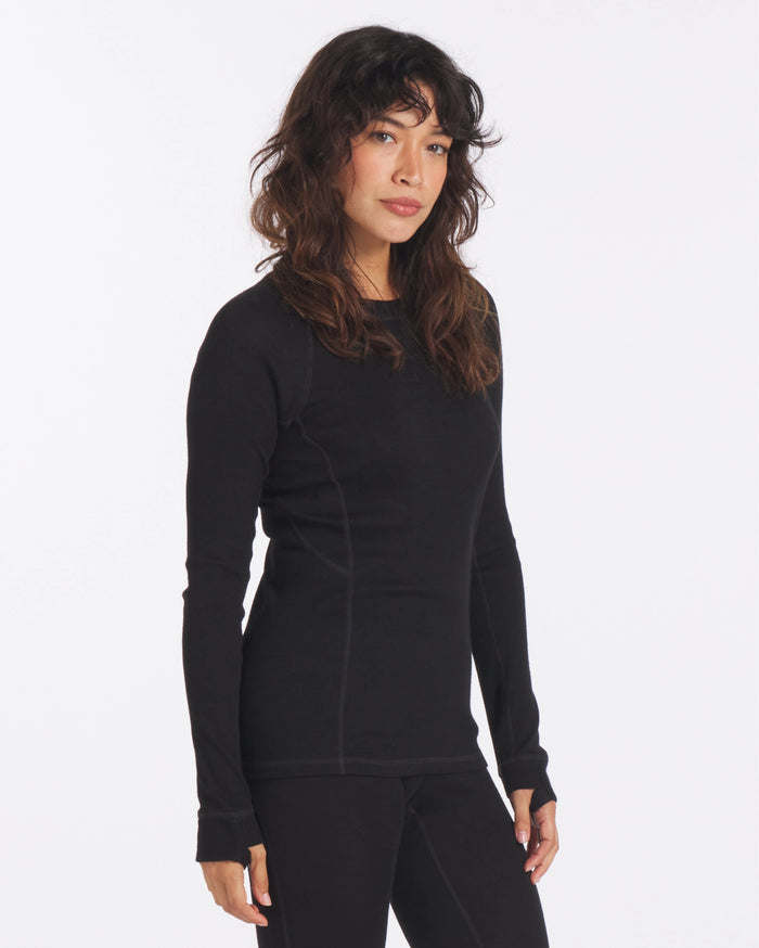 Woman with Arms at Sides in Black Alpaca Wool Thermal Baselayer Shirt for Skiing, Snowboarding and Winter – PAKA Apparel