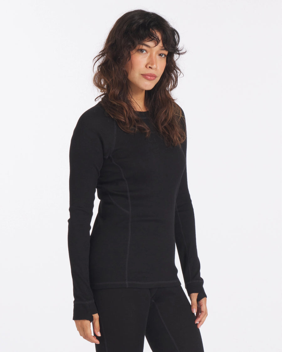 Woman with Arms at Sides in Black Alpaca Wool Thermal Baselayer Shirt for Skiing, Snowboarding and Winter – PAKA Apparel