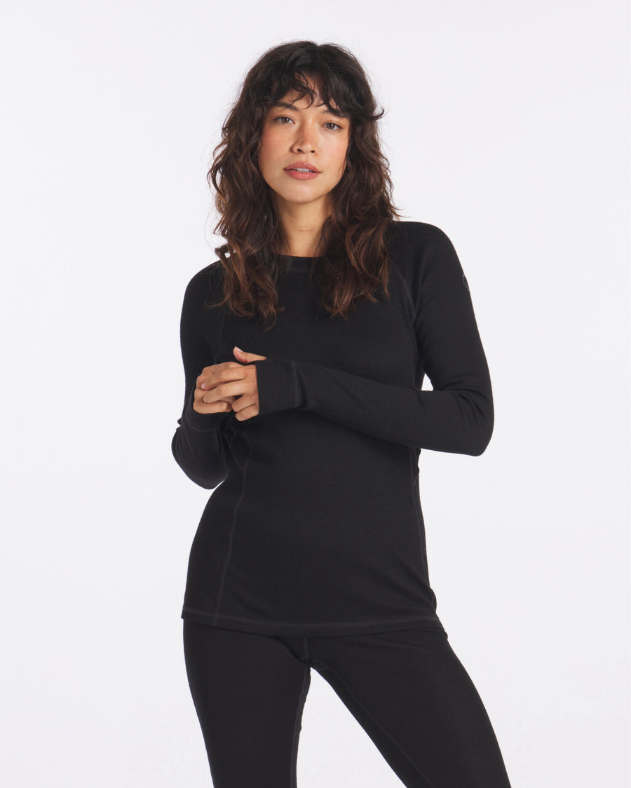 Woman with Hands Together in Black Alpaca Wool Thermal Long Underwear Top – PAKA Apparel