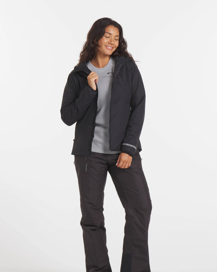 Woman Smiling in Unzipped Black Apu Water Resistant Lightweight Puffer Jacket – PAKA Apparel