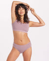 Woman Smiling with Hands Connected Overhead in Quail Pink Alpaca Bralette - PAKA Apparel