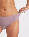 Close-Up of Model Stretching Waistband of Quail / Pink Women's Sustainable Alpaca Underwear – PAKA Apparel