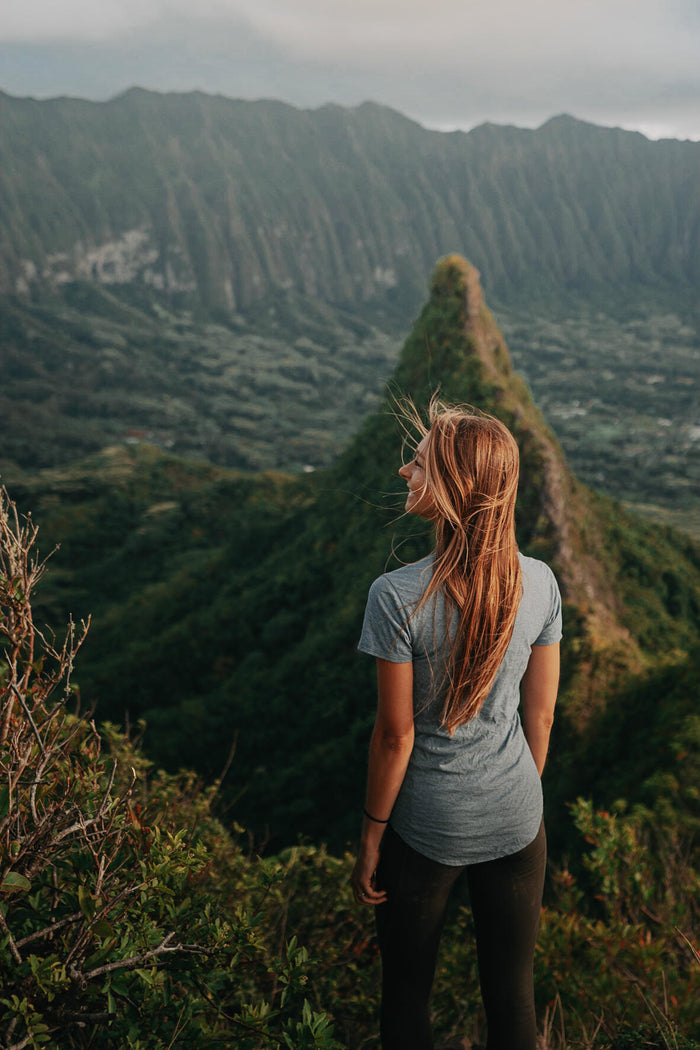 A lady wearing our alpaca tee looking at the nature