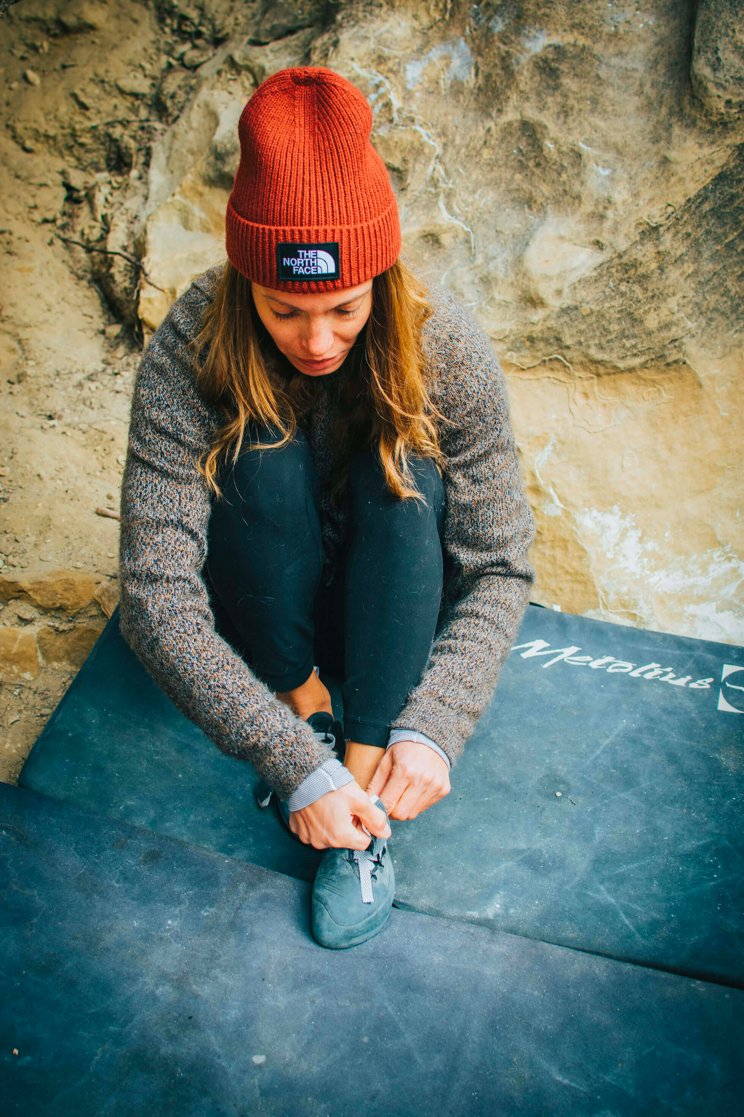 PAKA Ambassador Lindsey Young, Rock Climber, Putting on Climbing Shoes