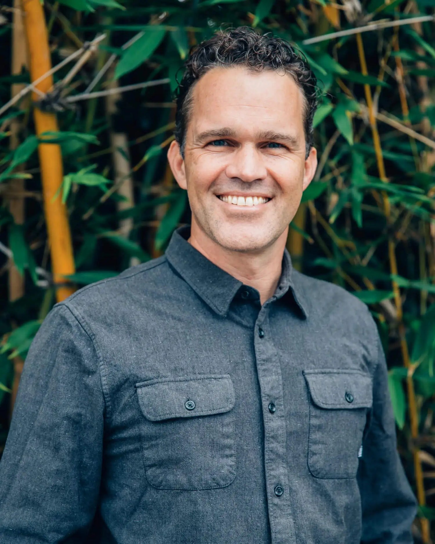 PAKA Ambassador Dr. Zach Bush in Front of Green Plants and Bamboo