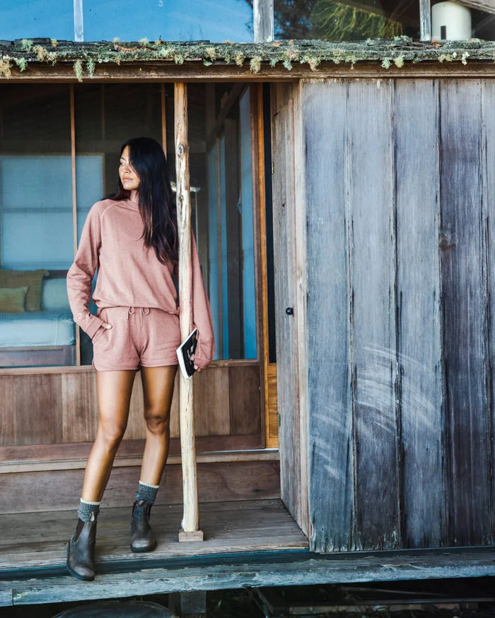 Model Standing on Covered Wooden Porch in Iron Oxide / Pink Women's Alpaca Terry Lounge Shorts – PAKA Apparel