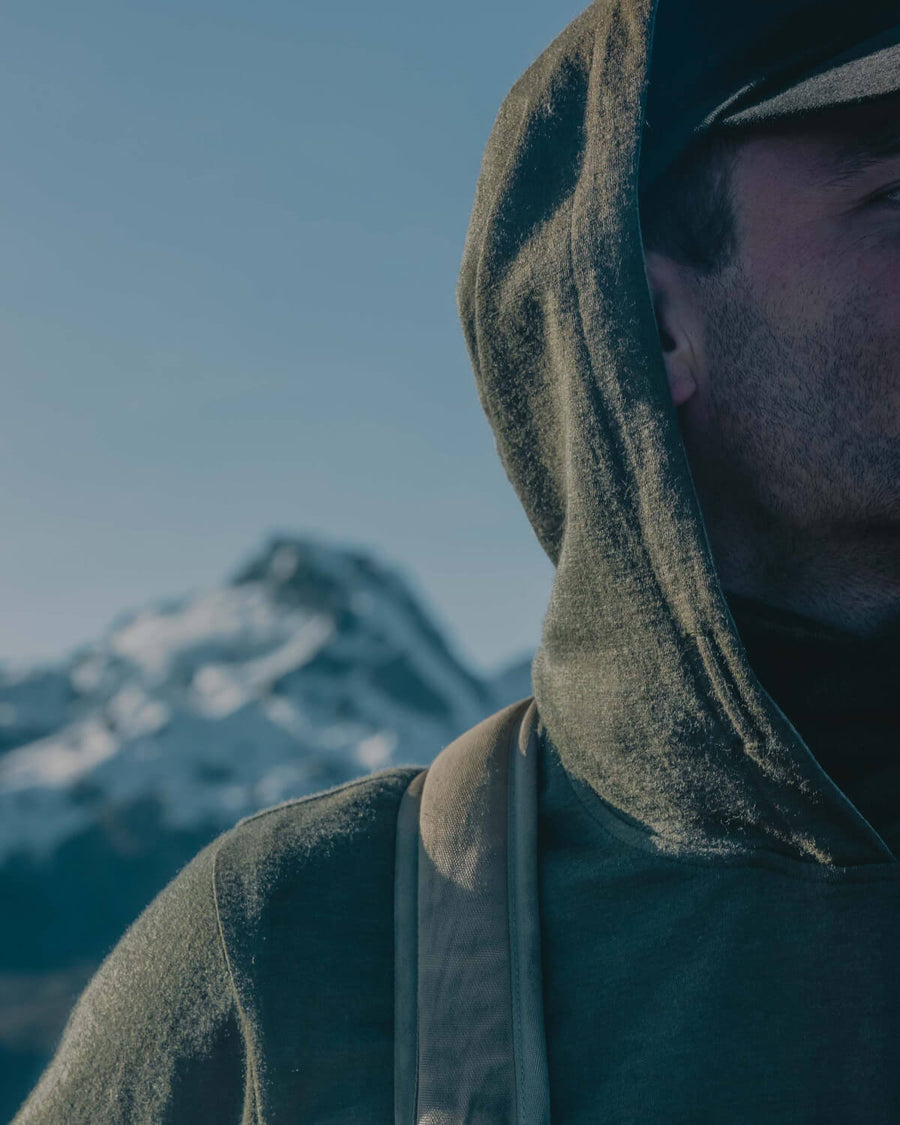 Man wearing Breathe Hoodie in the mountains