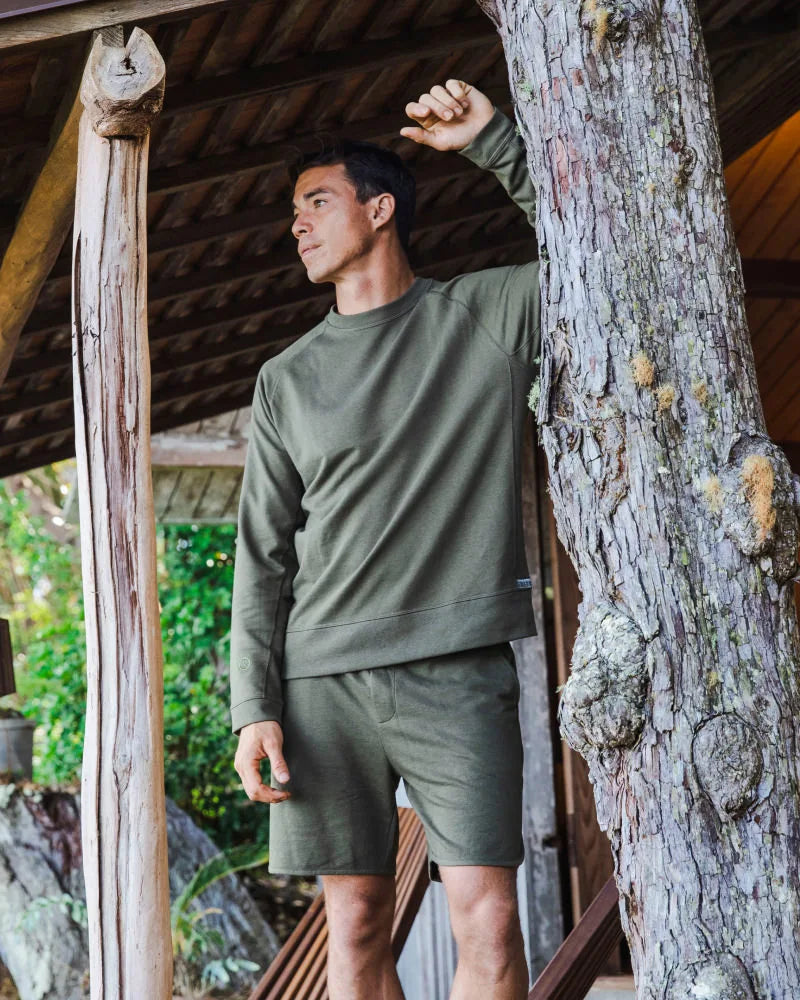 Man with Arm Rested on Tree in Andean Moss / Dark Green Terry Cloth Shorts with Royal Alpaca, Organic Pima Cotton and Tencel – PAKA Apparel