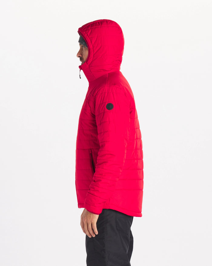 Side Profile of Model with Hood Up Wearing Apu Oxblood / Red Sustainable Men’s Midweight Puffer Jacket – PAKA Apparel