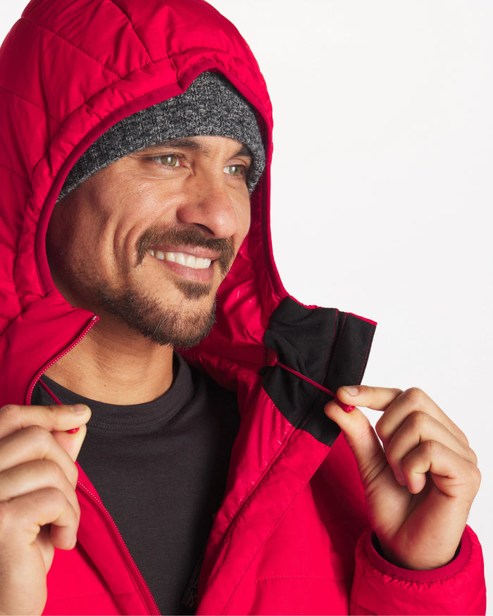 Man smiling wearing mens red puffer