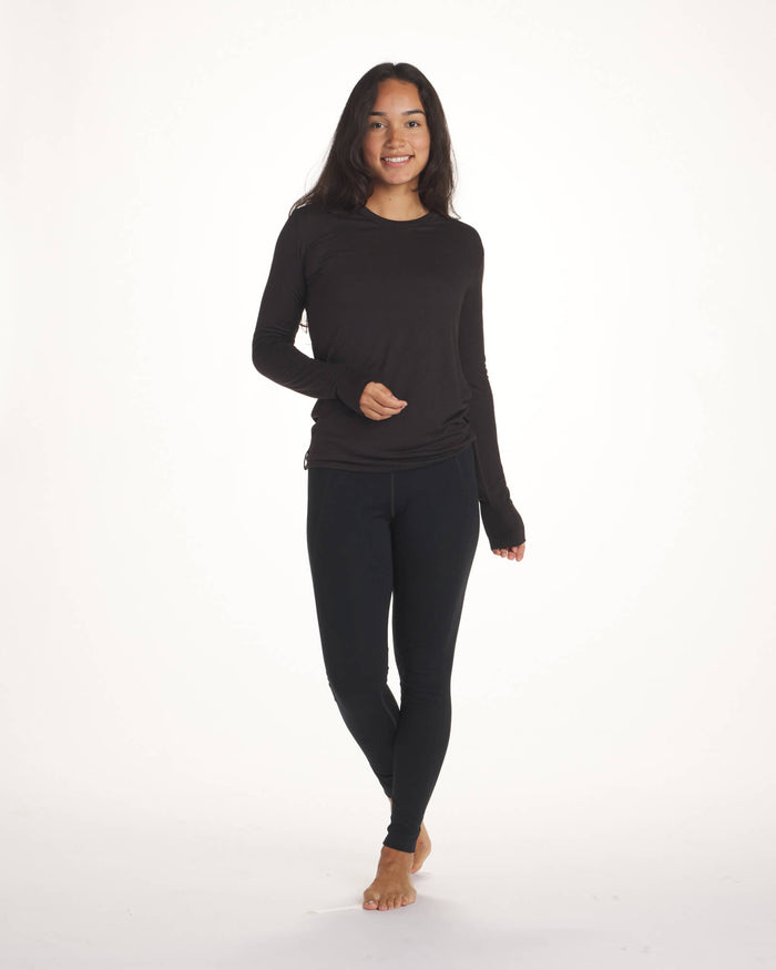 Black women's alpaca wool base layer on model