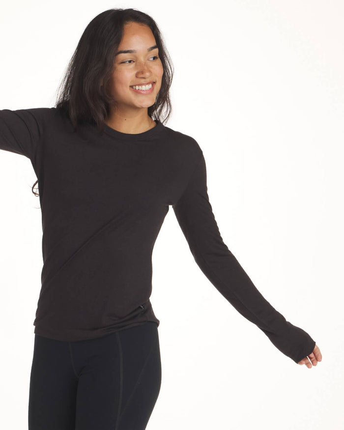 Black women's alpaca wool base layer on model