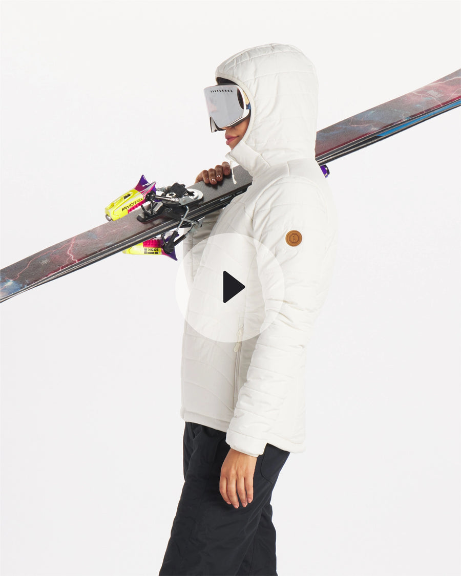 Video of woman wearing white puffer