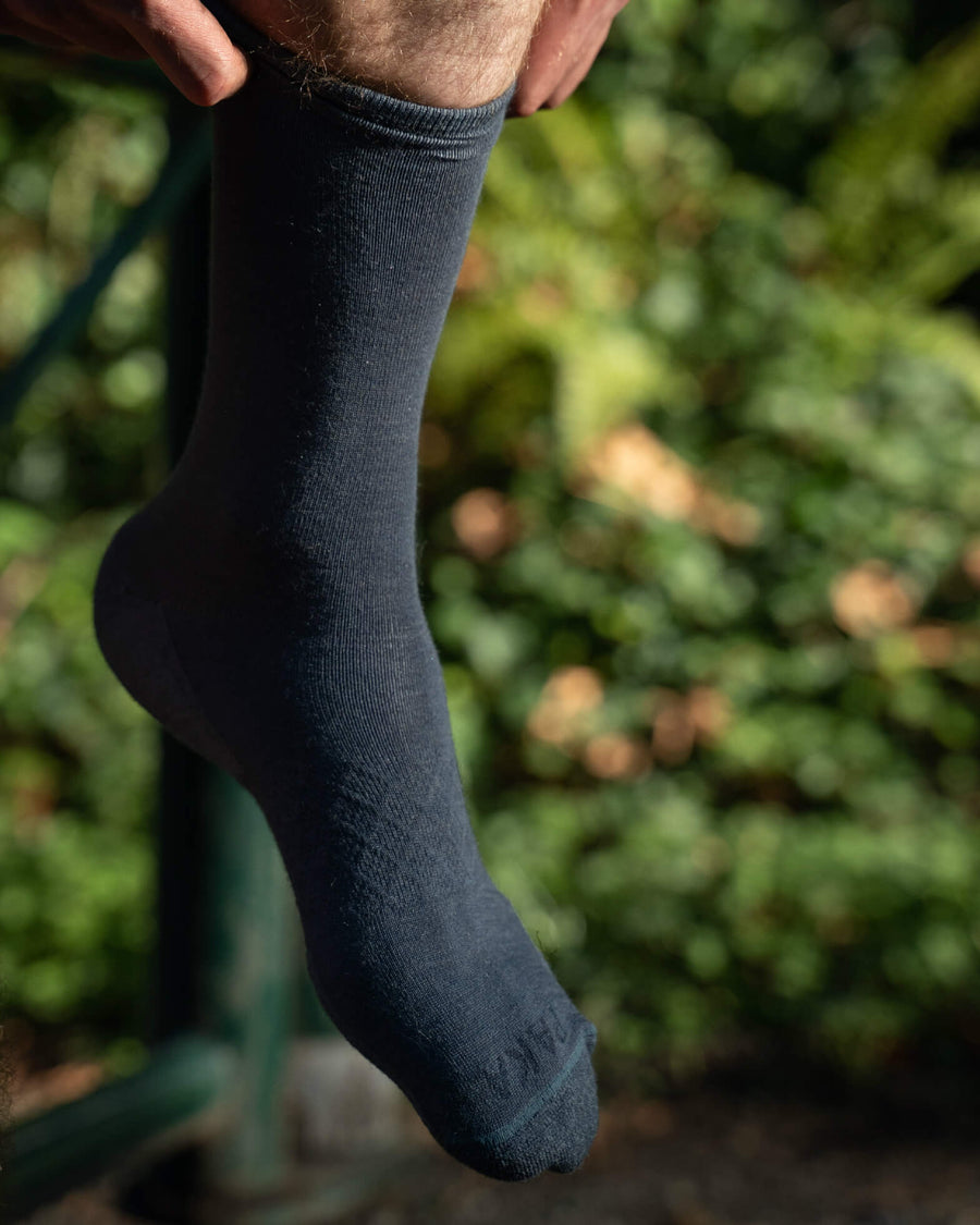 Blue alpaca wool alpaca socks on male model 